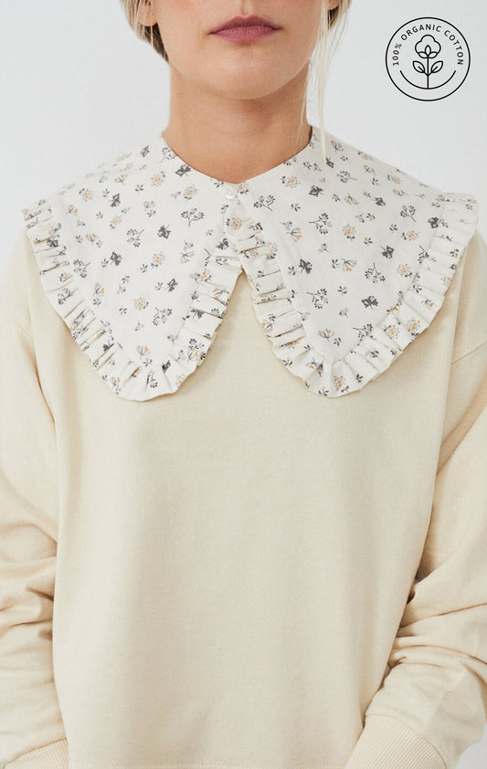 Sudadera con CUELLO independiente NOY (not only yoga) modelo CLAIRE de algodón orgánico estampado con flores en tonos neutros atado con botón en la parte delantera